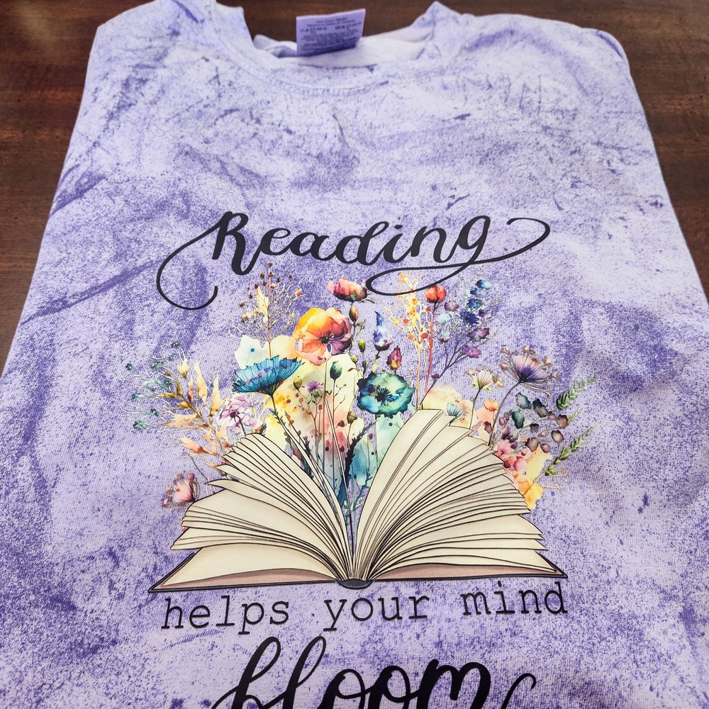 Purple Graphic Tee with Floral Book Design
